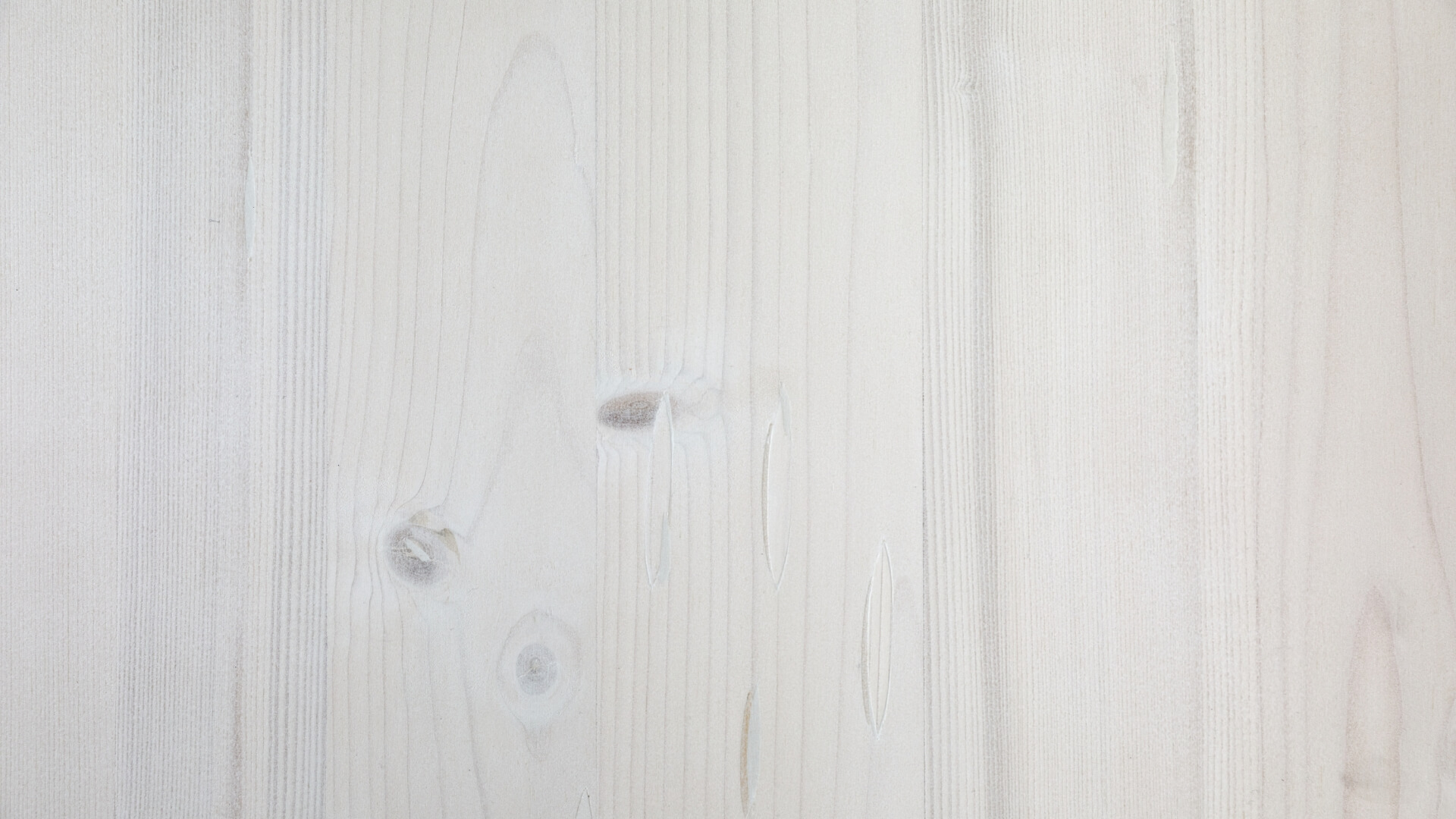 Die Holzplatte der Designgarnitur Riva in Weiß.