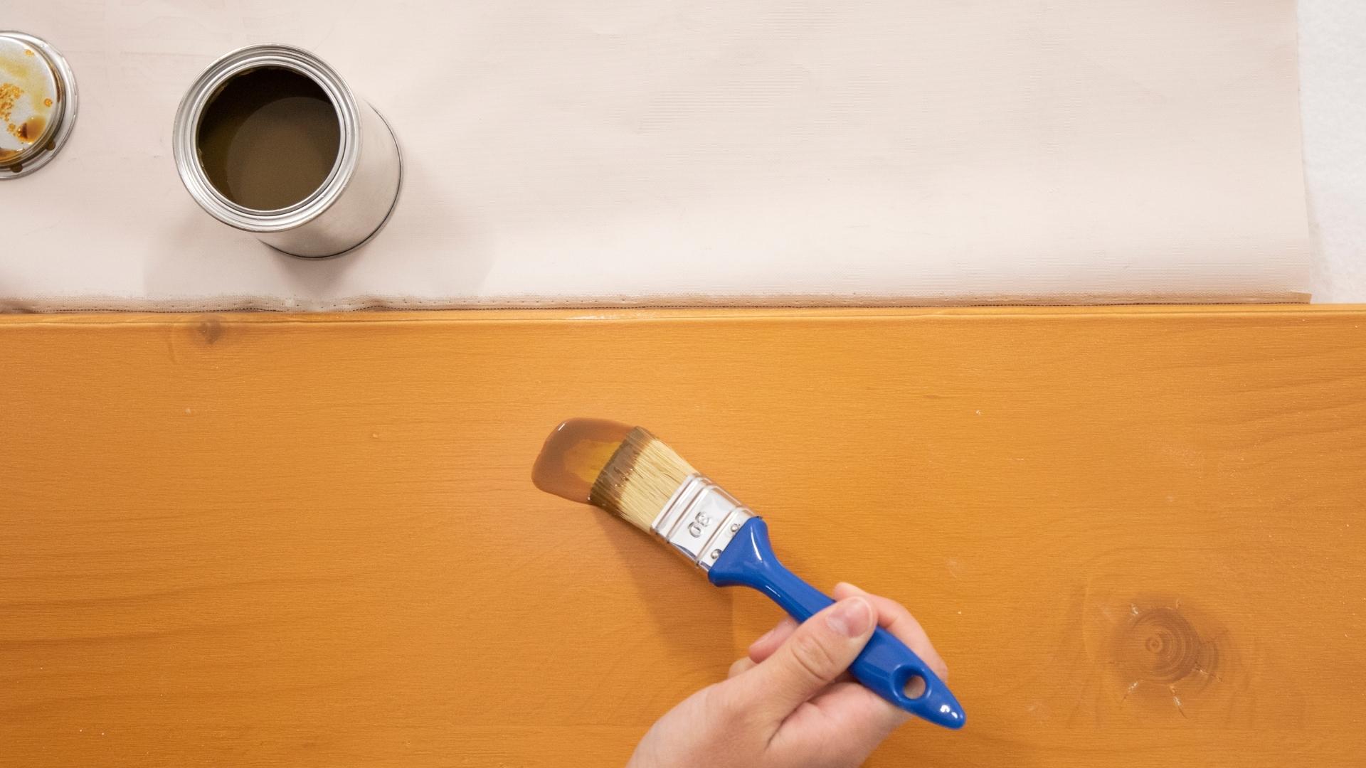 Apply the glaze to the beer garden table sets with a brush.