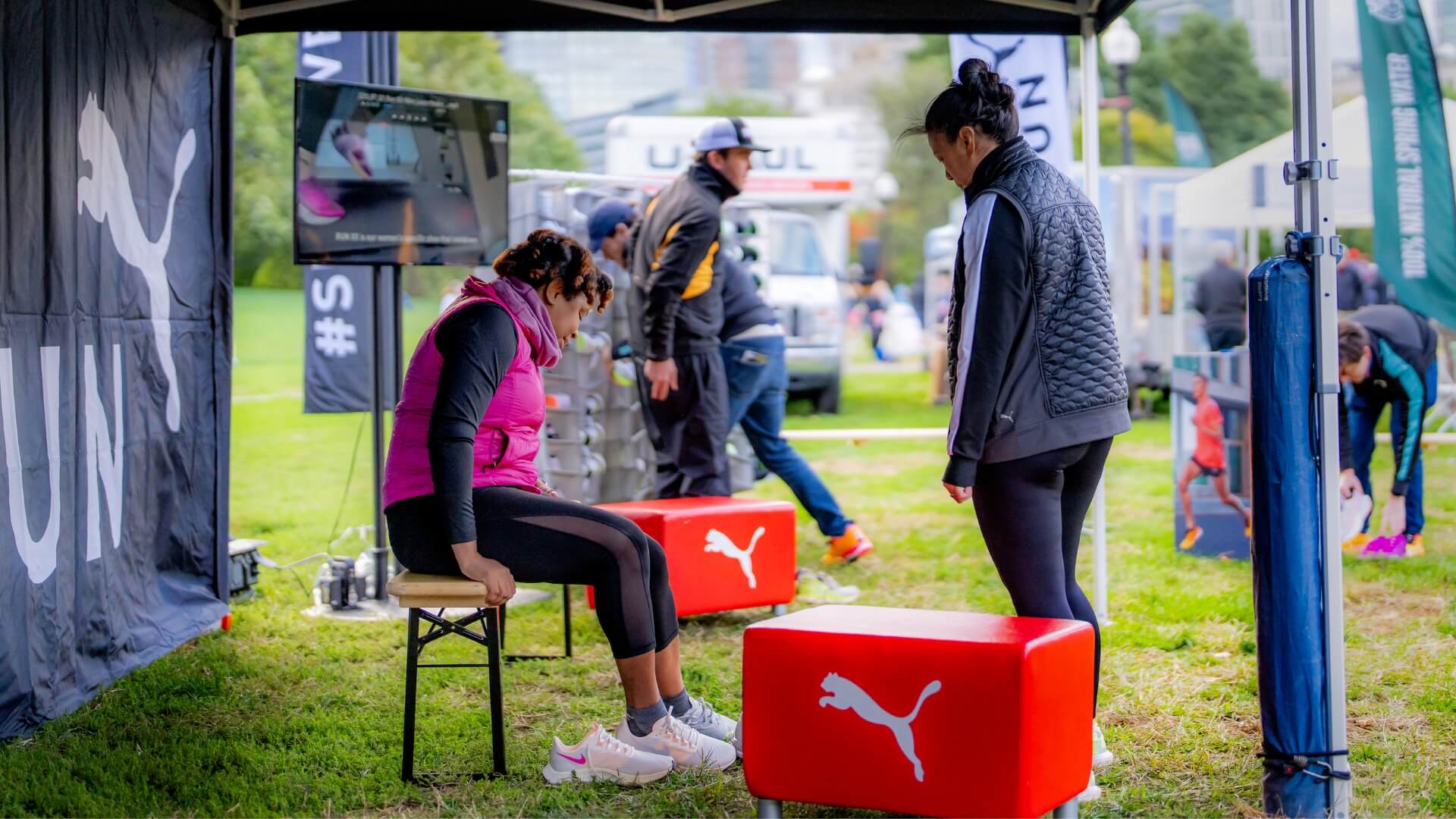 At the 10k Puma Marathon for Women in Boston, women were able to use the small beer bench to try on a wide variety of shoes.