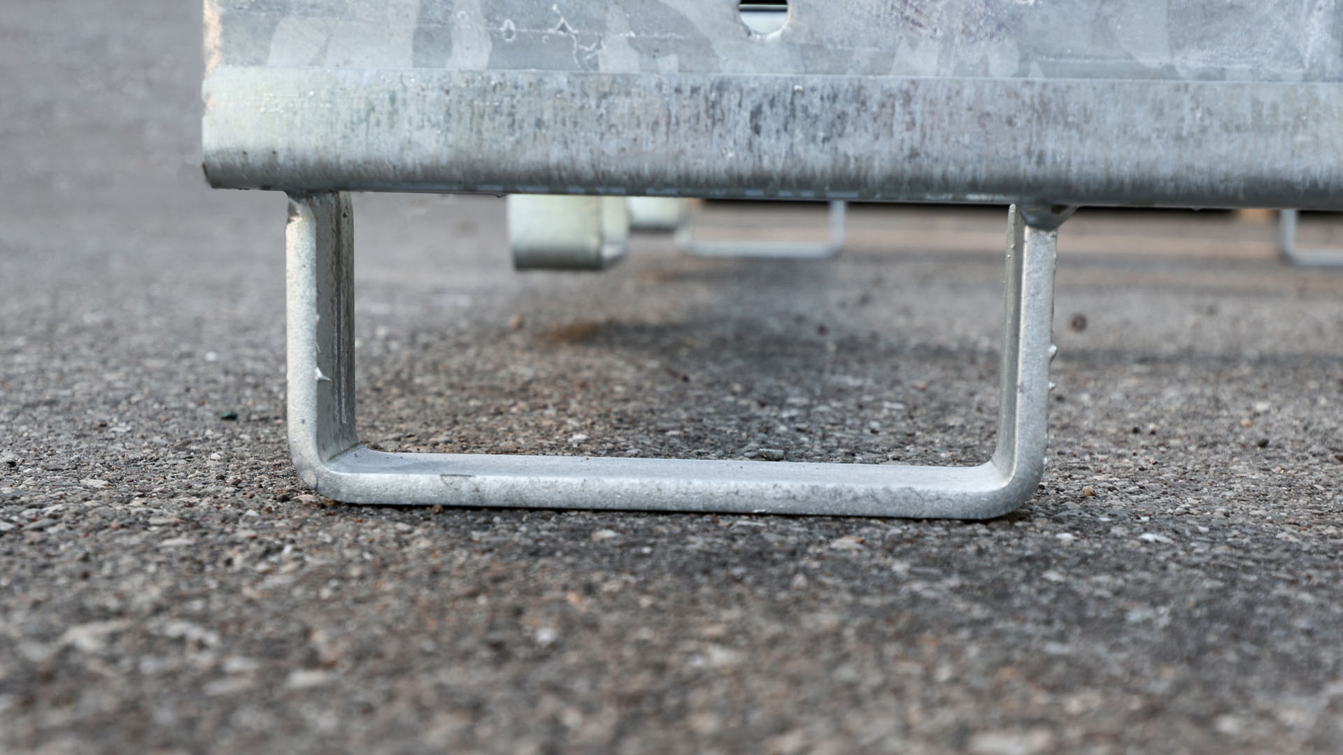 There are forklift fork straps on the transport container.