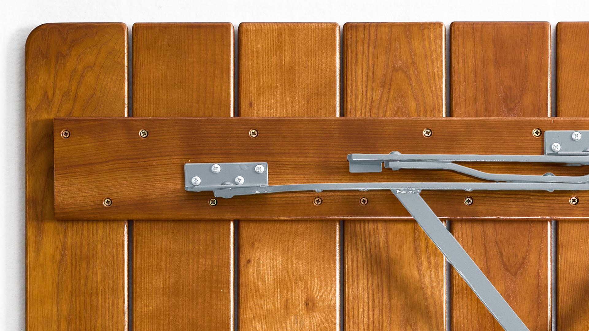 The underside of the square beer garden table is depicted.