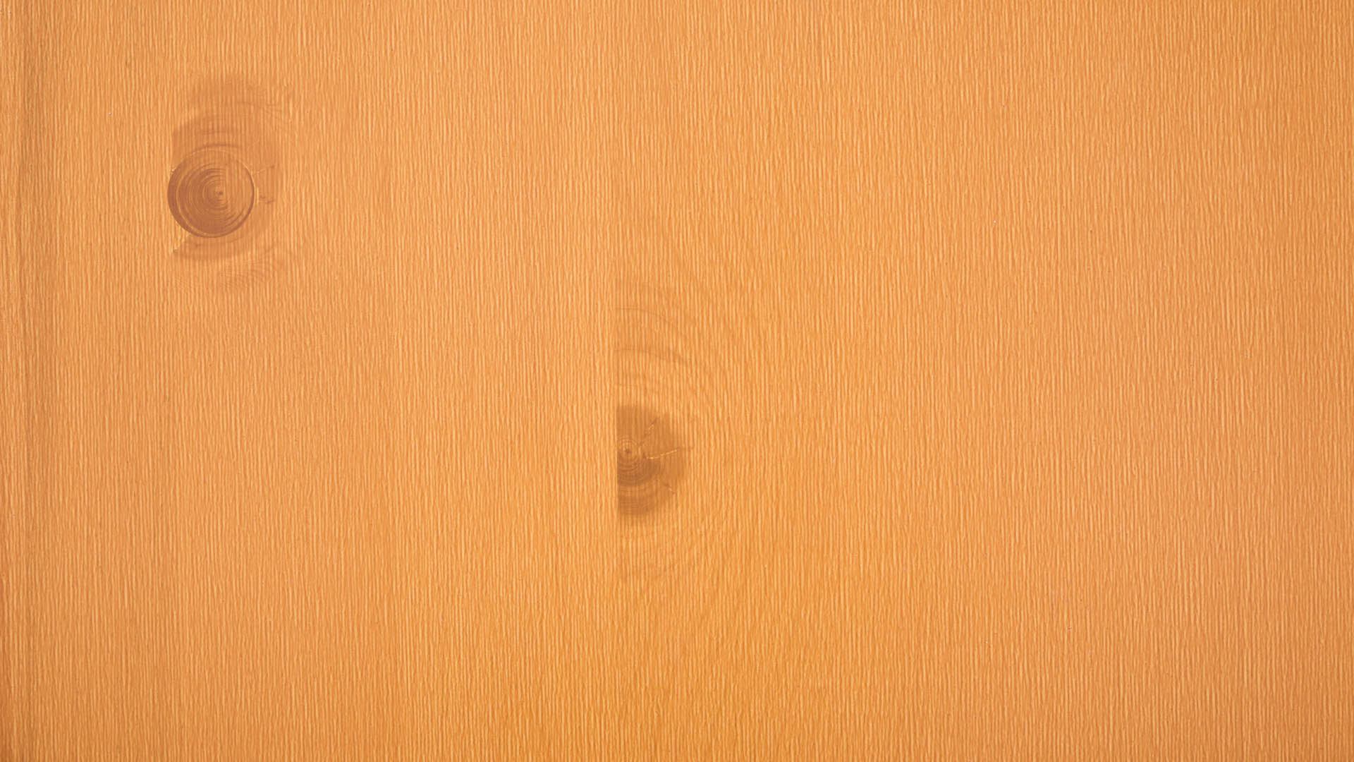 The wooden top of the beer garden table sets in pine