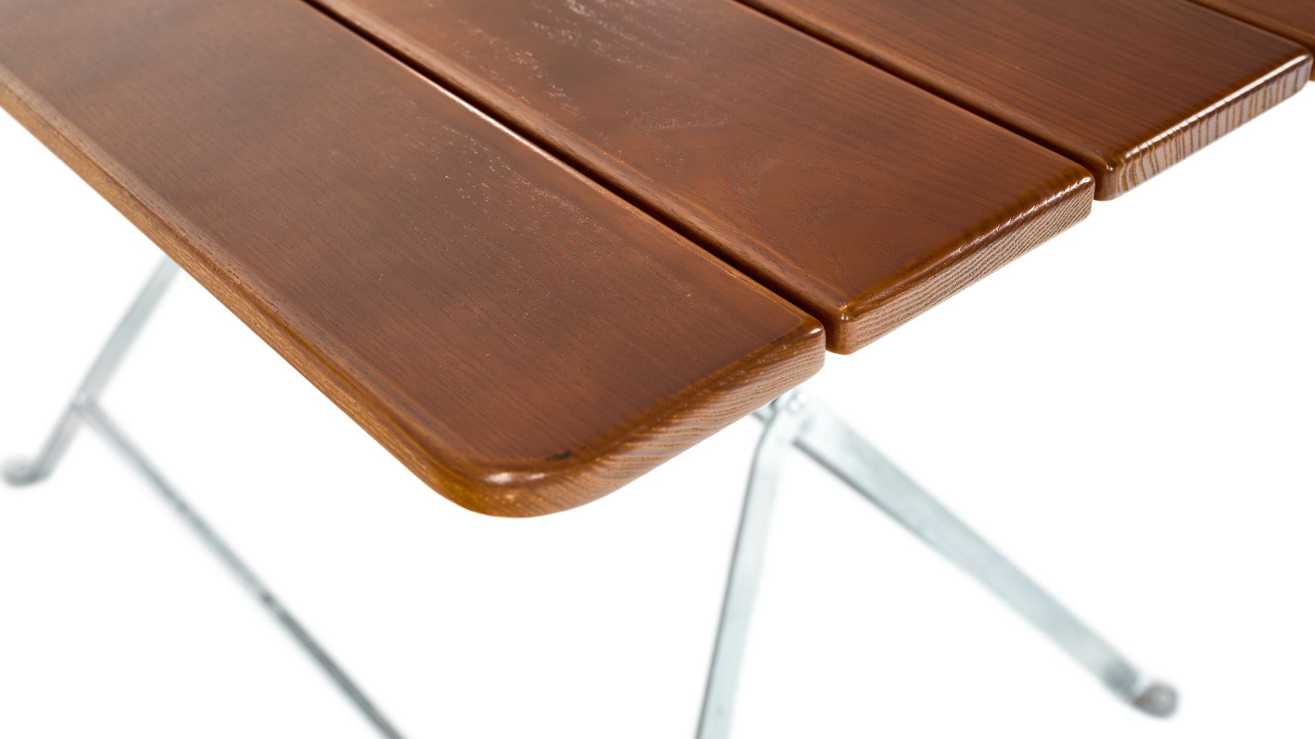 The wooden slats are always rounded on the beer garden table.