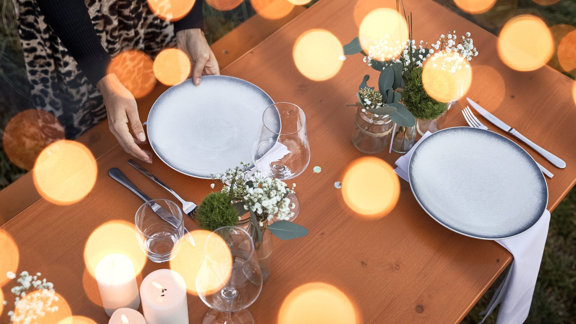  Wide beer garden table set is romantically set and decorated. 