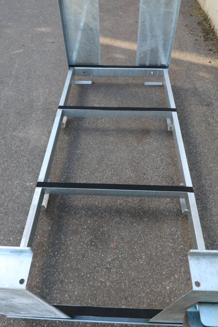 The photo shows the interior of an empty transport rack for beer tent sets.