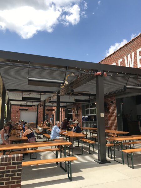 In the outdoor area of Wooden Robot Brewery, numerous beer tent sets in pine have been arranged.